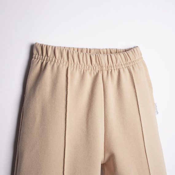 221275 Kiku Nicol pantalones anchos para niña beige con ribete
